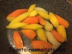 Tentacoli di polpo alla piastra su insalata di carote multicolor al burro e timo